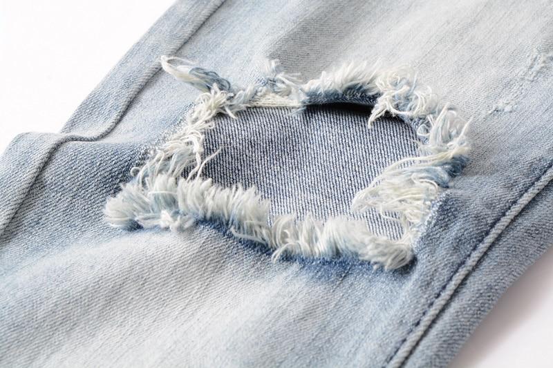 Ripped jeans, light blue color, slim fit 
